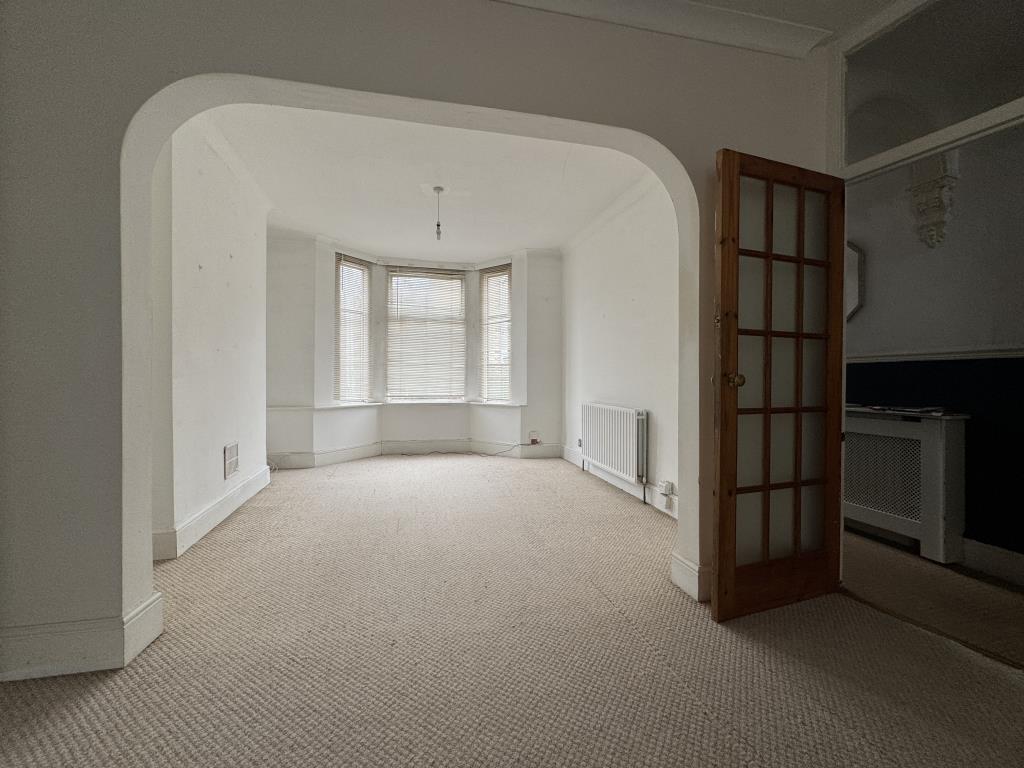 Lot: 152 - TWO-BEDROOM MID-TERRACE HOUSE IN NEED OF RENOVATION - Dining room to the living room